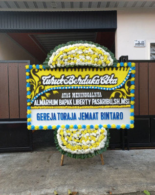 Papan Bunga Duka di Girian Bawah